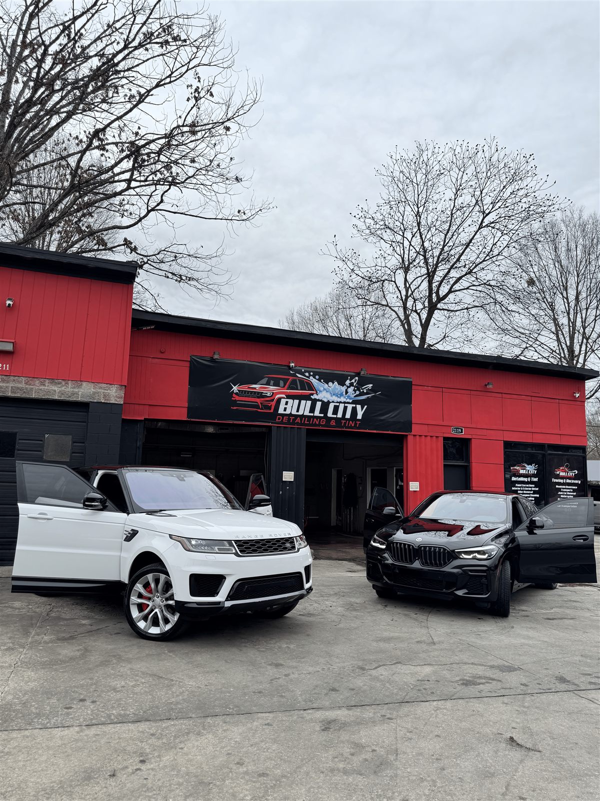 Range Rover and BMW with window tint at Bullcity Detailing & Tint